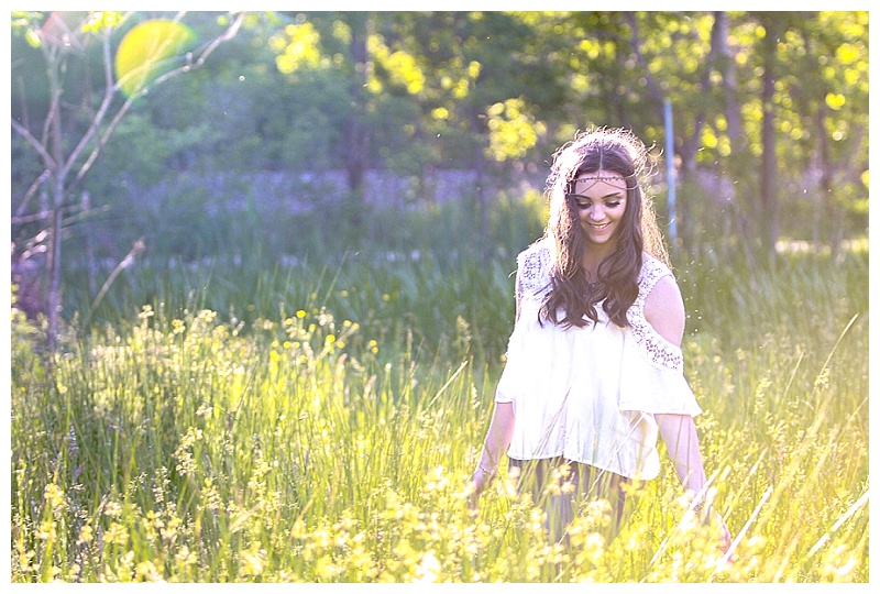 bohemian themed teen portraits with a buttercup field offlowers